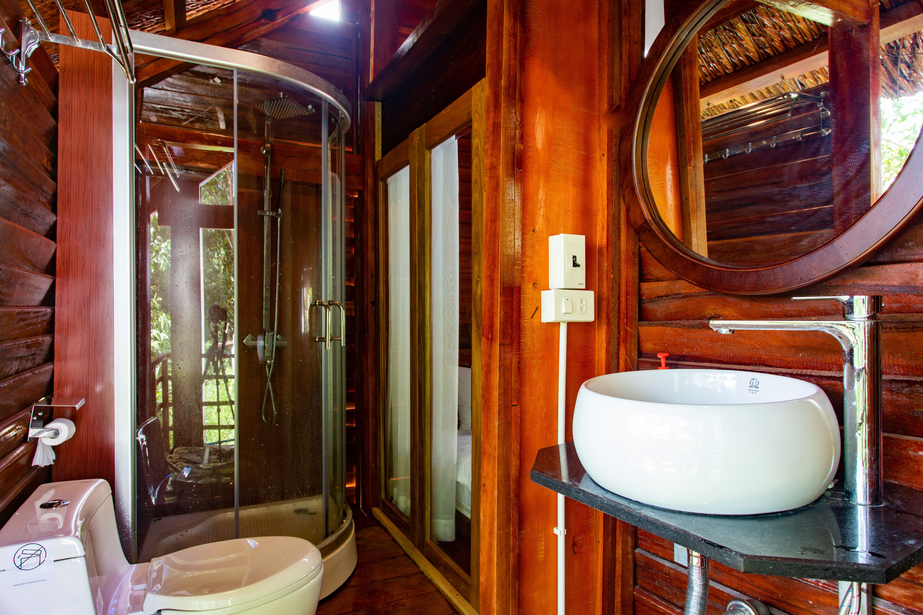 deluxe bungalow | bathroom | designer toiletries, hair dryer, slippers, bidet