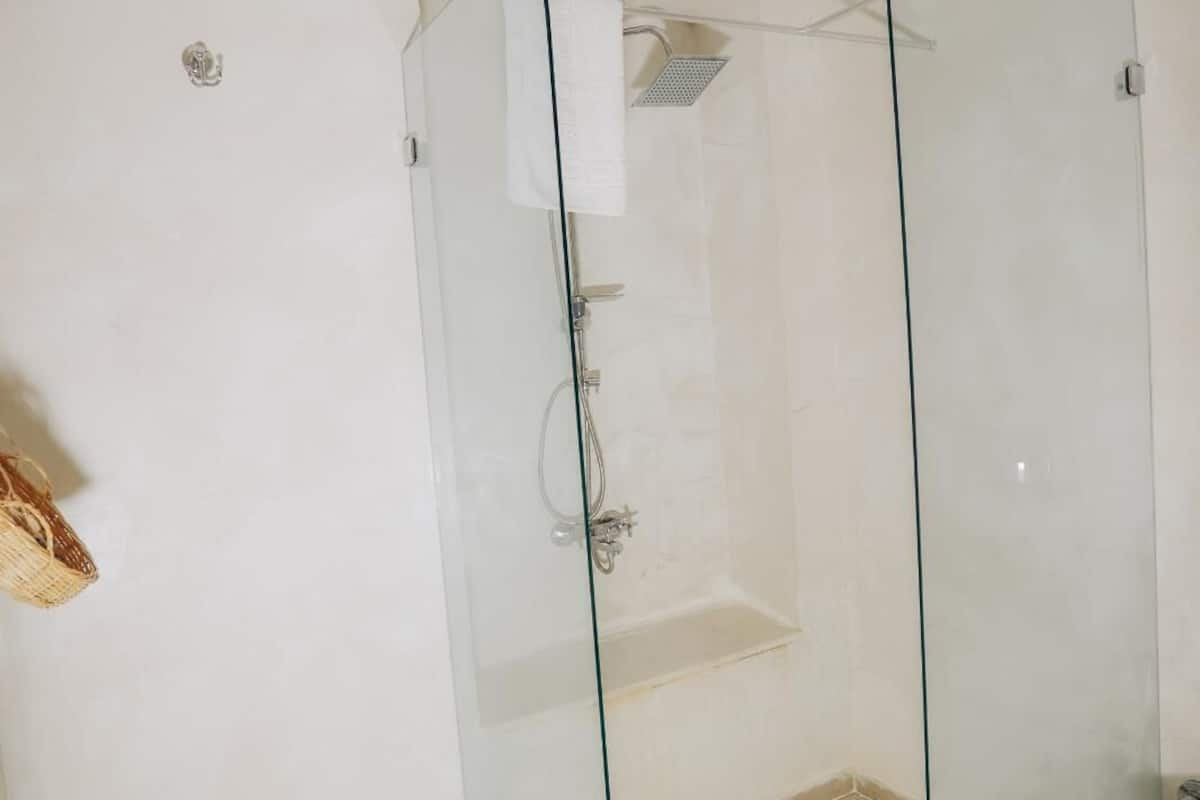 standard double room | bathroom | shower, hair dryer, slippers, towels