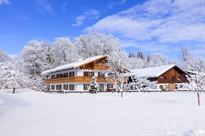 Experience the charm of a traditional Alpine lodge, surrounded by serene winter landscapes.
