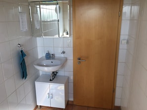 Shower, towels, soap, toilet paper