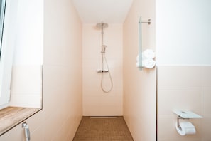 Shower, hair dryer, towels, toilet paper