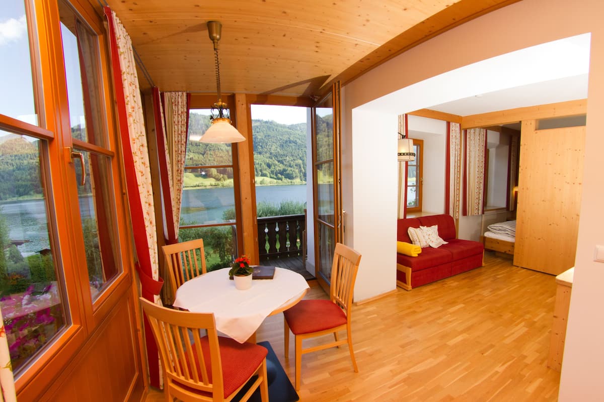 Apartment, 1 Bedroom, Balcony, Lake View (incl. Cleaning fee) | Living area | 35-inch Smart TV with satellite channels, TV, toys