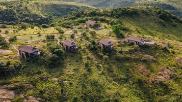 Surrounded by lush greenery and rolling hills, this secluded retreat offers a peaceful mountain setting.