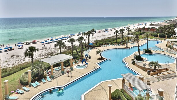 A resort with a large pool area, a beach, and a view of the ocean. - 4 BR En Soleil Directly on Gulf, Beautiful With Free Beach Chairs.  6th Floor (Panama City)