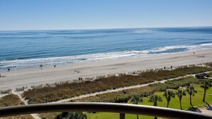 A beach with a clear view of the ocean and a pathway leading to the beach. - Direct OceanFront, Modern, Clean, King Bed, Quartz Counters (Myrtle Beach)