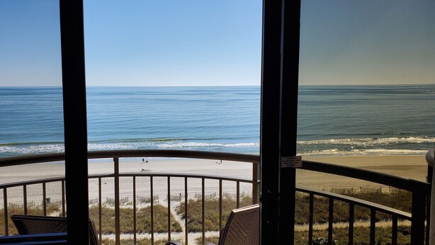 A balcony with a view of the beach and ocean. - Direct OceanFront, Modern, Clean, King Bed, Quartz Counters (Myrtle Beach)