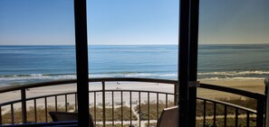 A balcony with a view of the beach and ocean. - Direct OceanFront, Modern, Clean, King Bed, Quartz Counters (Myrtle Beach)