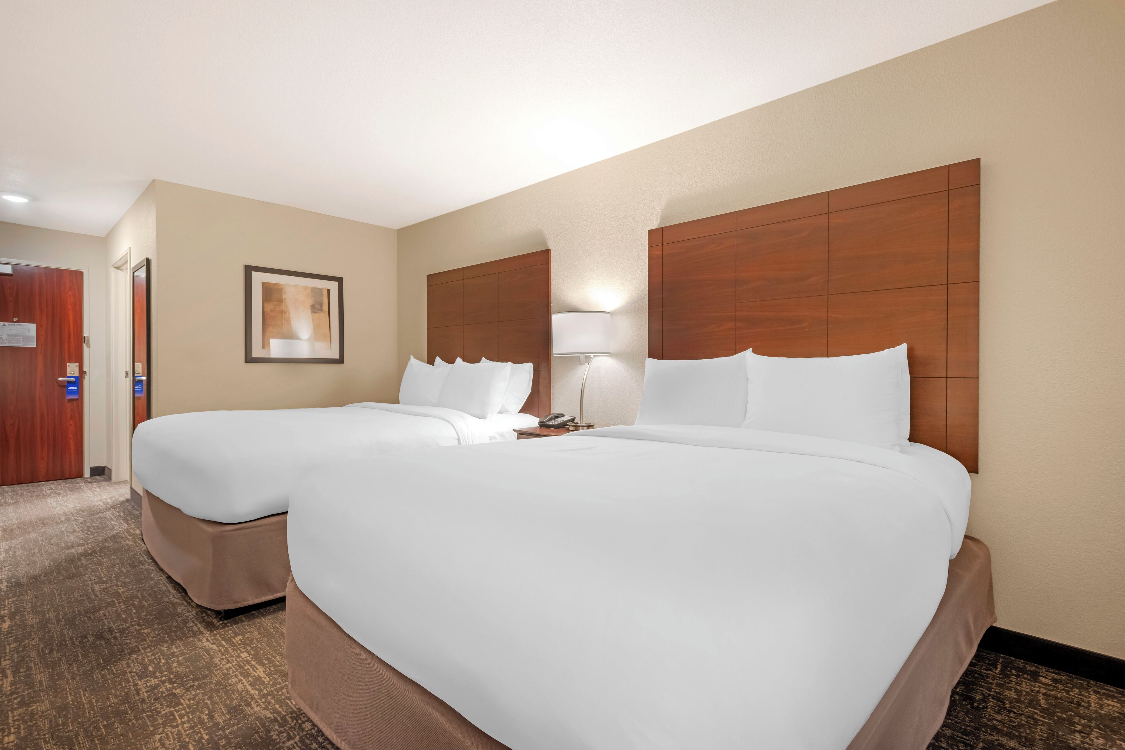 Down comforters, pillowtop beds, in-room safe, blackout drapes