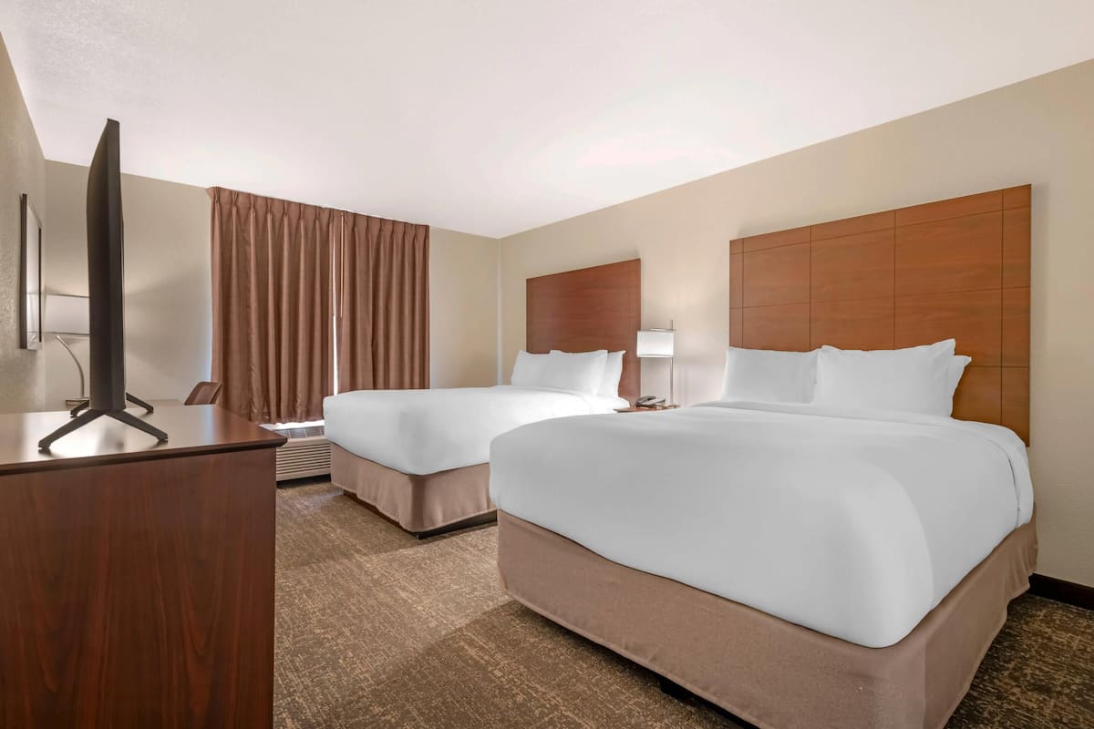 Down duvets, pillow-top beds, in-room safe, blackout curtains