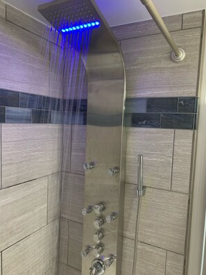 Shower, hair dryer, towels, soap
