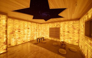 A room with a brick wall, a wooden ceiling with a star design, a small table, and cushioned seating. - Guangzhou Nanmei Osotto Recreation Hotel (Guangzhou)