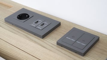 A gray electrical box with two USB ports and a circular opening, and a smaller gray box with "MAIN LIGHT" and "FOOT LIGHT" labels.