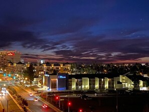 A hotel with a modern design, featuring a prominent glass facade and a well-lit entrance. - Luxury Smart Home w/Gorgeous Waterfront Retreat + Amazing Sunset Views (Marina Del Rey)