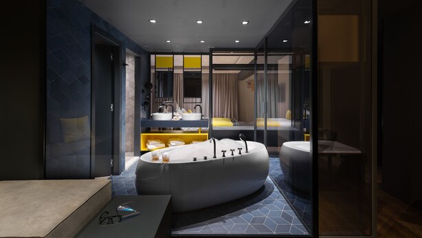 A modern bathroom with a freestanding bathtub, a vanity with a mirror, and a shower area.