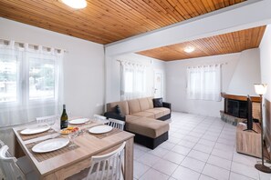 Deluxe House, 3 Bedrooms, Sea View | Living area | Flat-screen TV, fireplace