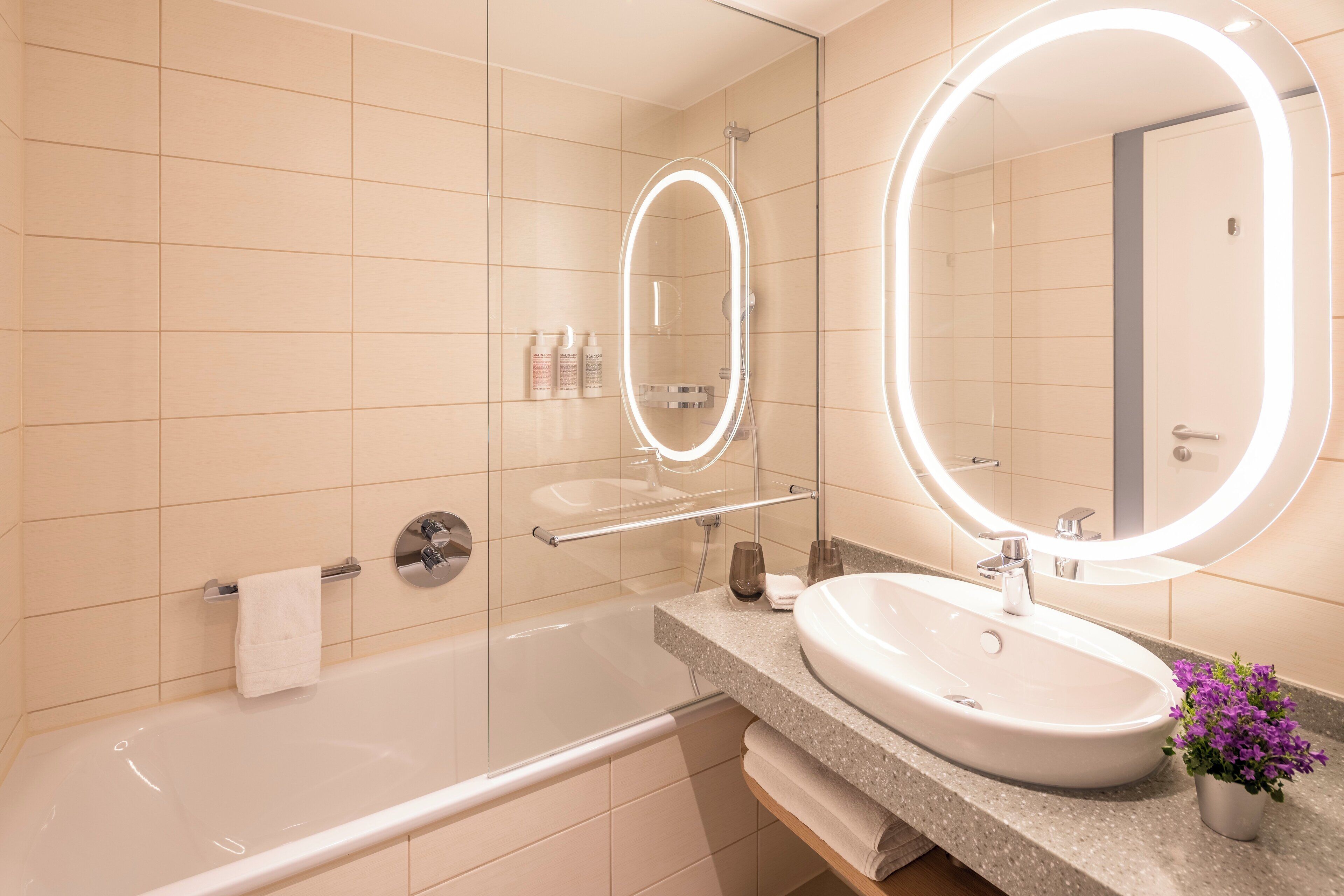 designer toiletries, hair dryer, towels, soap