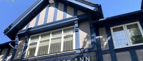 A building with a sign reading "The Bournbrook Inn" and "est. 1836".