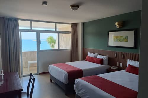 Habitación Deluxe, 2 camas matrimoniales | Wifi gratis y ropa de cama
