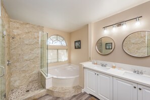 Combined shower/bathtub, hair dryer, towels, toilet paper
