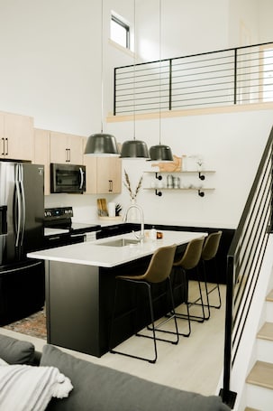 Fridge, microwave, oven, stovetop. Burnett Cottage Pine NewBo District Cedar Rapids Downtown