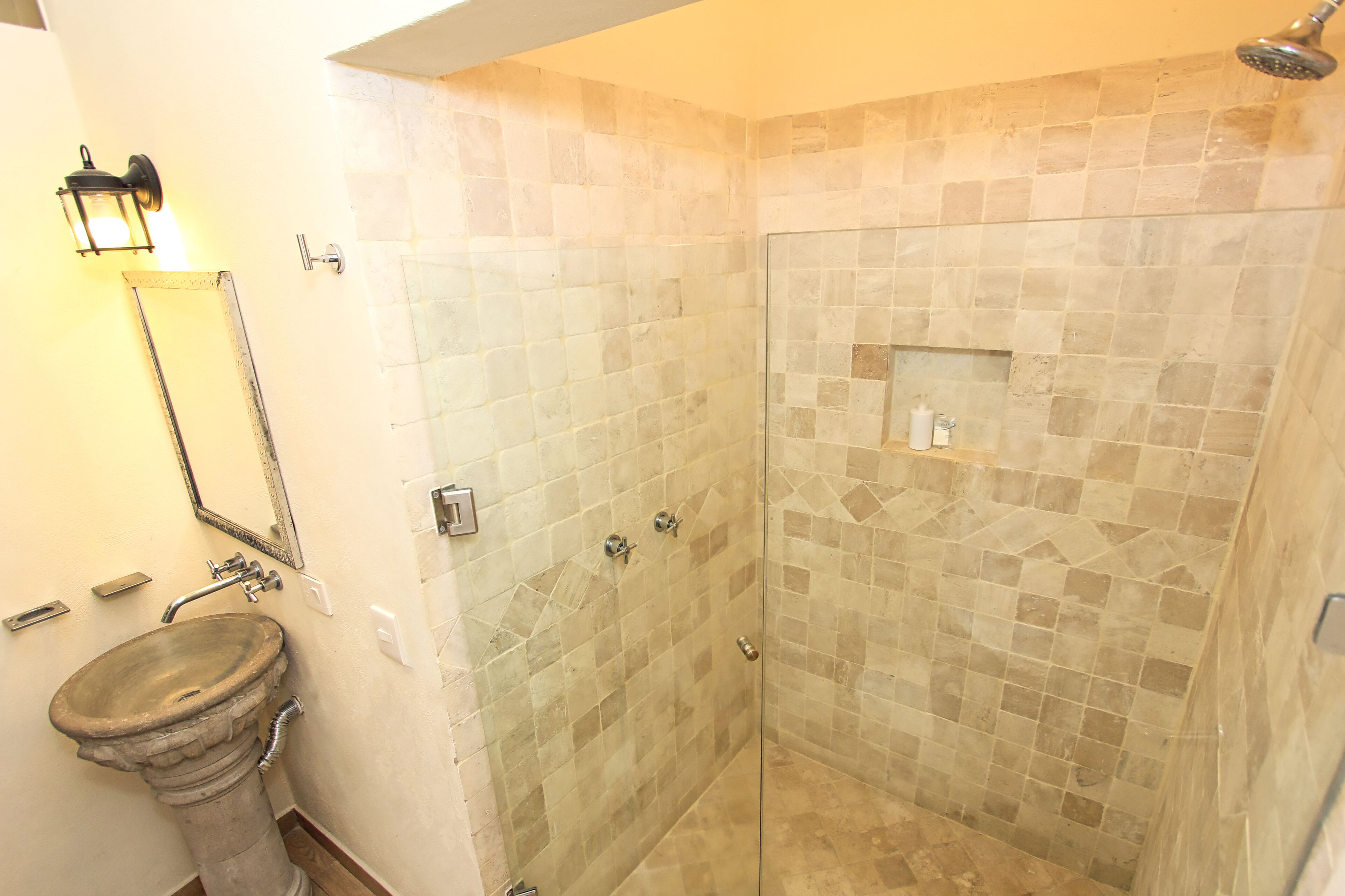 deluxe room | bathroom | shower, rainfall showerhead, hair dryer, towels