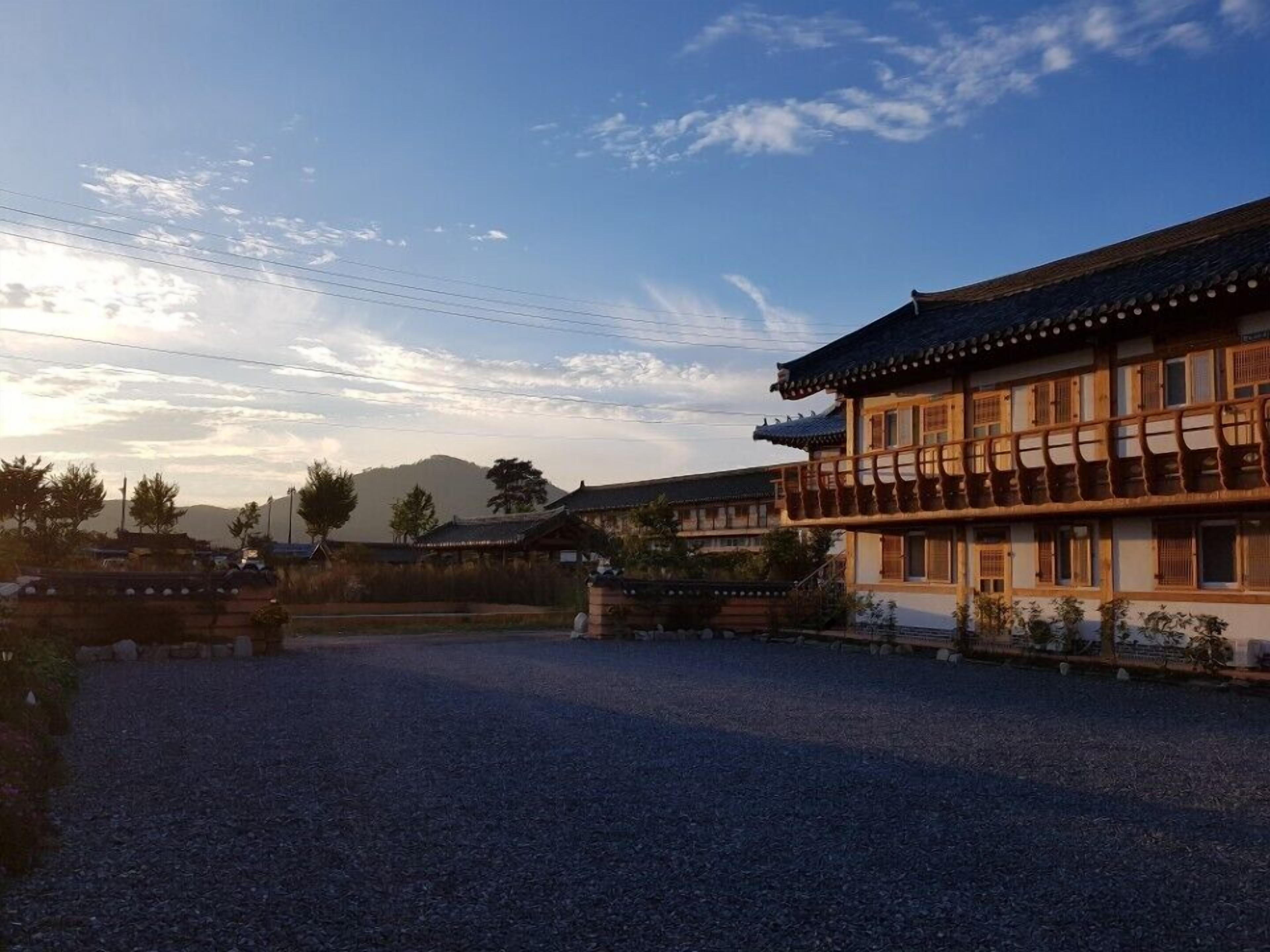 A traditional building with a tiled roof and wooden balcony railings.