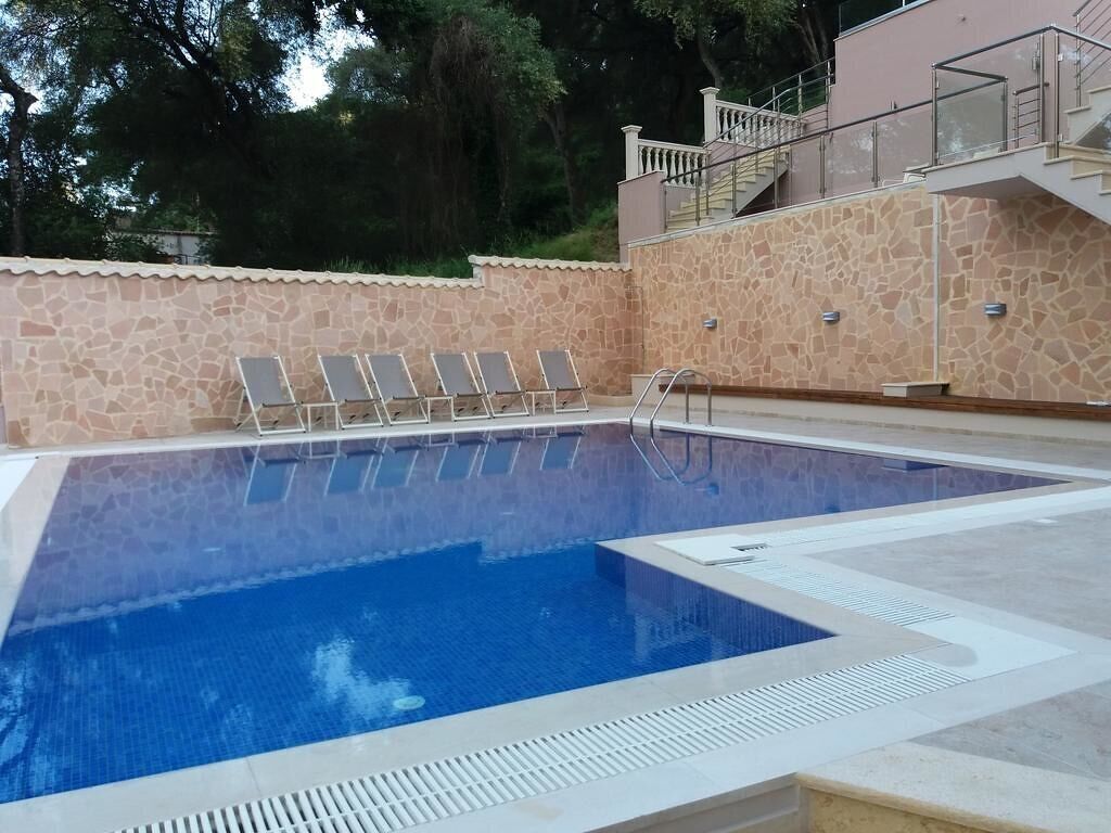 Seasonal outdoor pool, open 10:00 AM to 8:00 PM, pool umbrellas