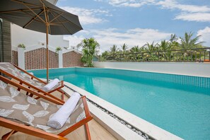 Outdoor pool, open 6:00 AM to 10:00 PM, pool umbrellas, sun loungers
