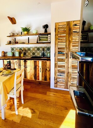 Fridge, microwave, stovetop, coffee/tea maker