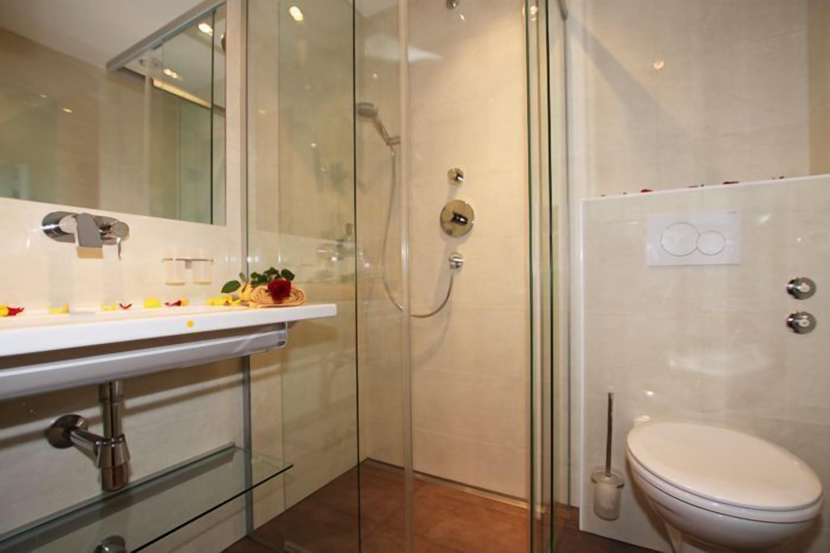 superior double room | bathroom | jetted bath, rainfall showerhead, hair dryer, towels