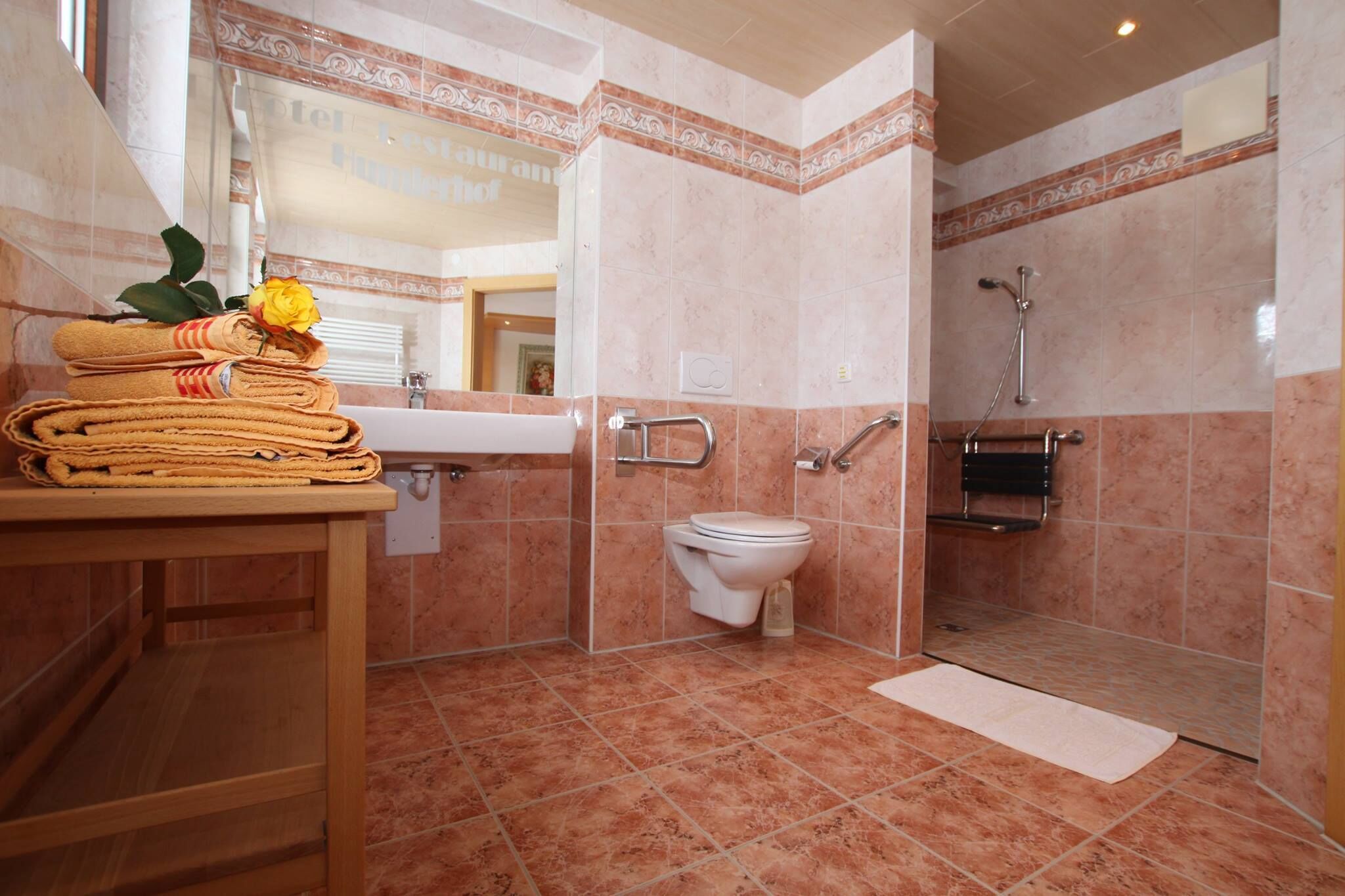 jetted bath, rainfall showerhead, hair dryer, towels