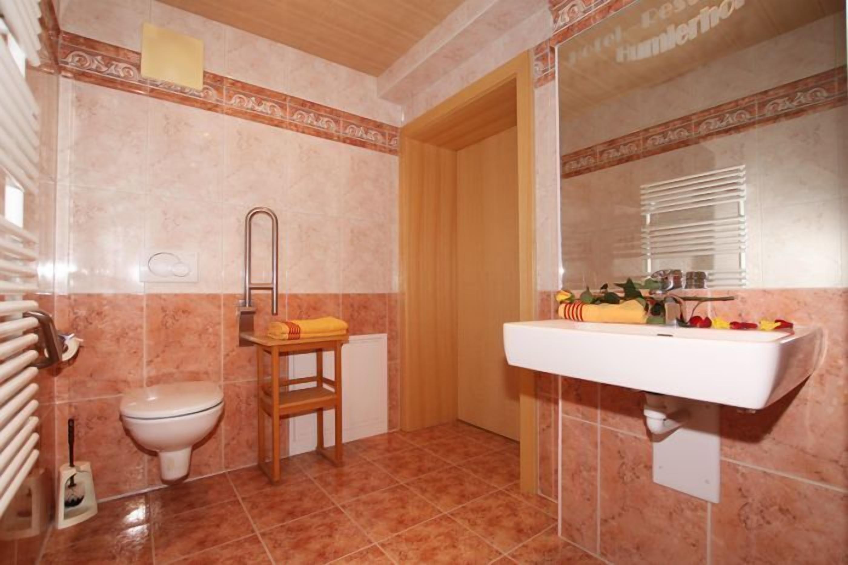 jetted bath, rainfall showerhead, hair dryer, towels