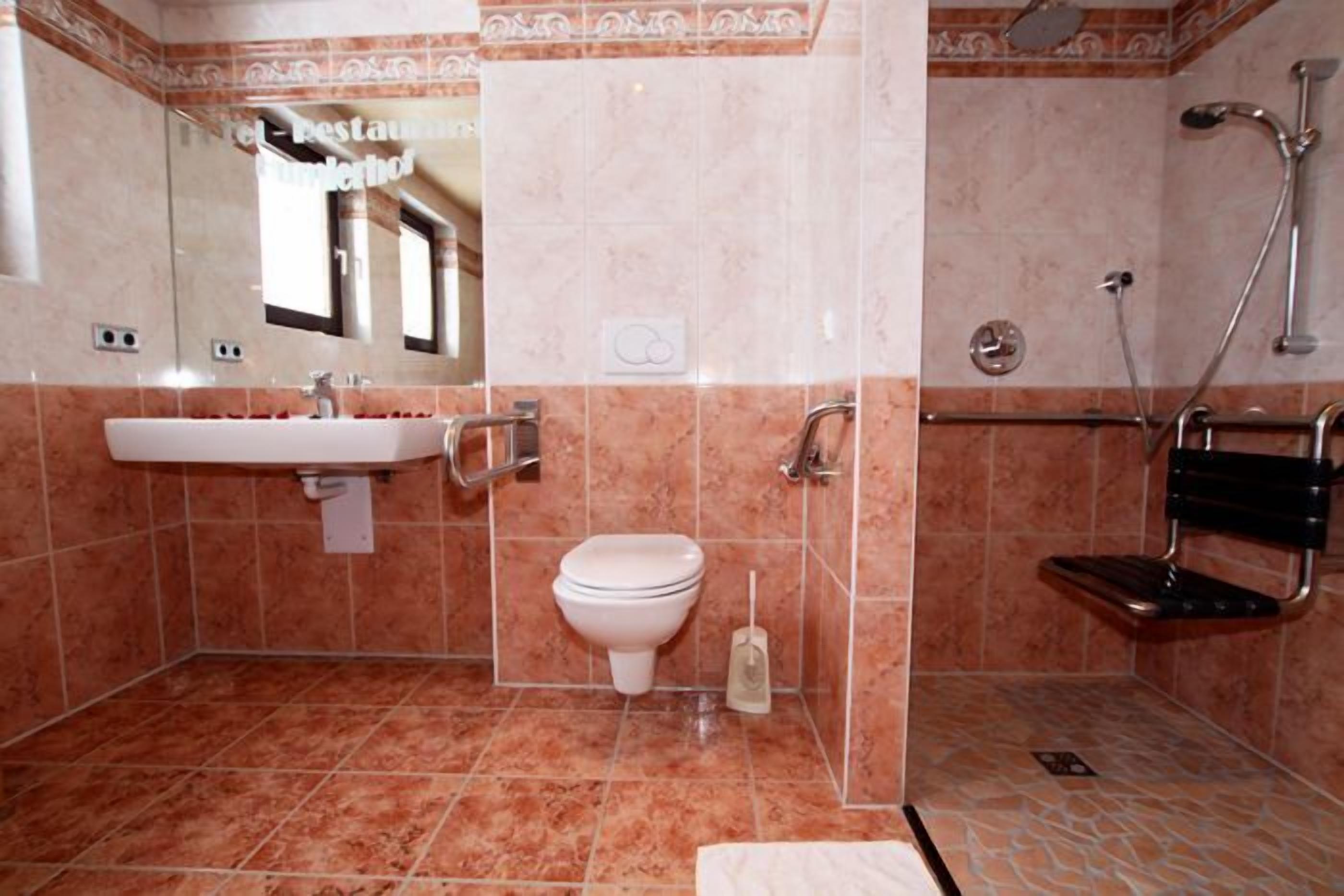 junior suite | bathroom | jetted bath, rainfall showerhead, hair dryer, towels