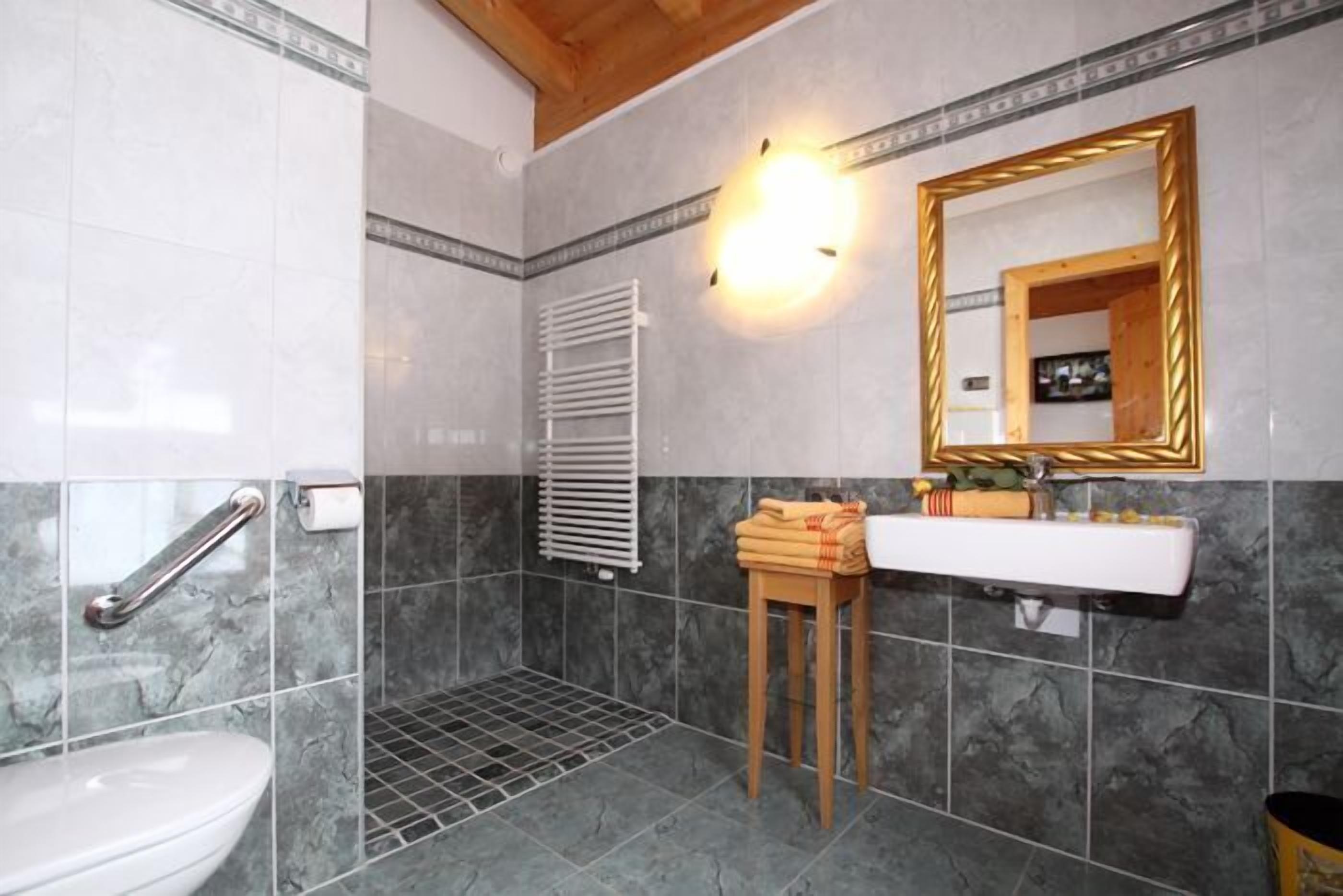 superior double room | bathroom | jetted bath, rainfall showerhead, hair dryer, towels