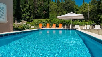 Seasonal outdoor pool, pool umbrellas, pool loungers