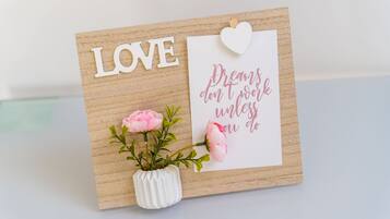 A greeting card with the word "LOVE" and a motivational quote.