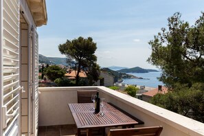 Enjoy breathtaking views of the coastline from this balcony.