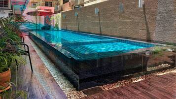 Outdoor pool, open 8:00 AM to 10:00 PM, pool loungers
