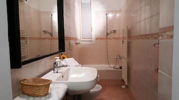 Apartment, 1 Bedroom | Bathroom | Separate bathtub and shower, rainfall showerhead, hair dryer, bidet
