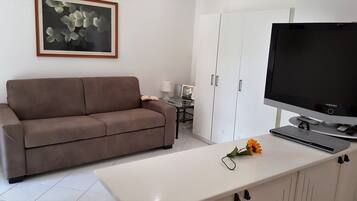 Apartment, 1 Bedroom | Living area | Flat-screen TV