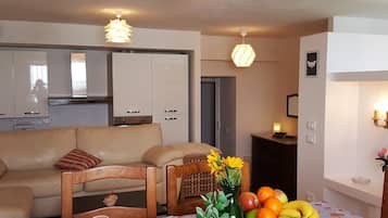Apartment, 1 Bedroom | Living area | Flat-screen TV