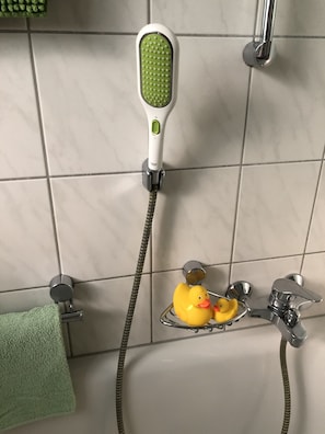 Combined shower/tub, hair dryer, towels, soap