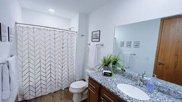 Bathtub, hair dryer, towels