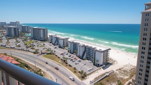 A coastal hotel with multiple floors, a parking lot, and a beach view. - L👀K!!! ⭐️ TOP RATED CONDO ⭐️ 3 Pools ⭐️ Breathtaking Ocean Views !!! (Panama City Beach)