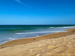 On the beach, sun loungers, beach towels