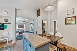 Enjoy cooking and dining in this well-equipped kitchen with a central island and dining area.