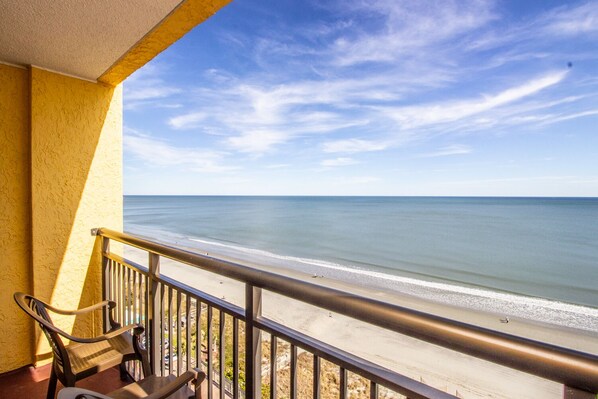 A balcony with a view of the beach and ocean. - Oceanfront, Modern, Clean, Pools, Hot Tubs, Kids Splash Park, Sleeps 6! (Myrtle Beach)
