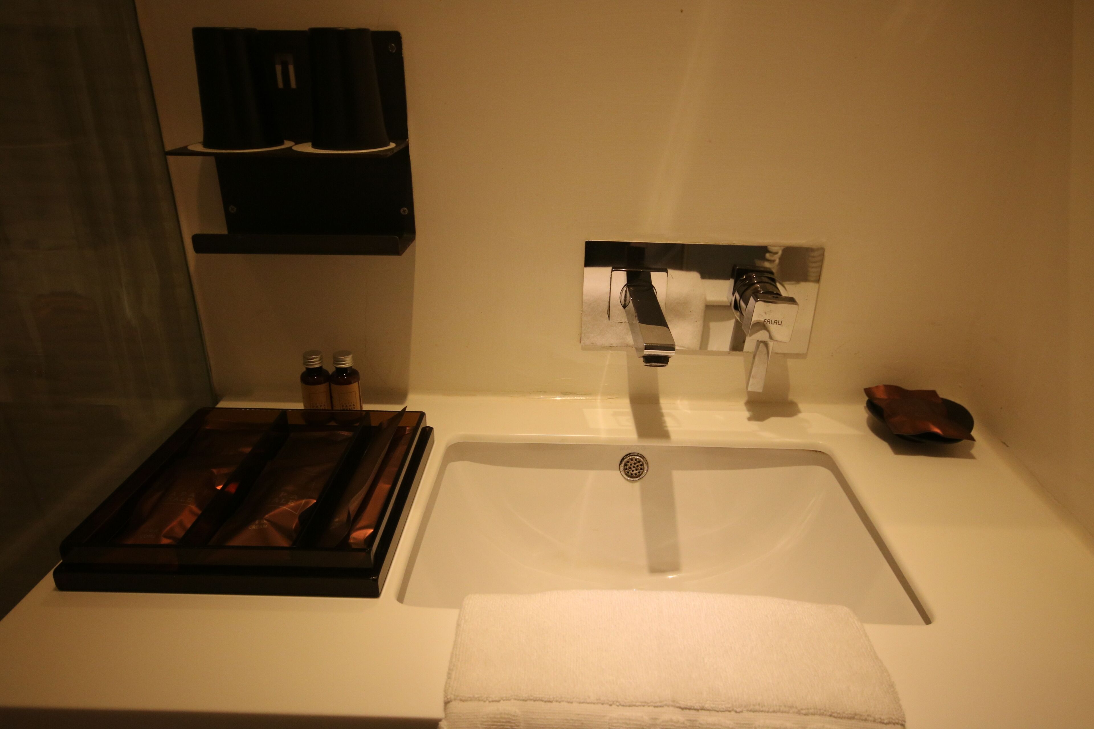 shower, hair dryer, slippers, towels