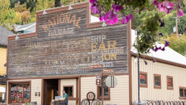 A wooden building with a sign that reads "The Old Town Bar & Grill."