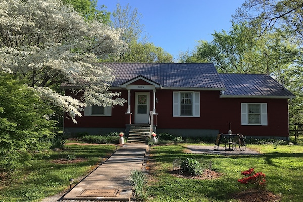 Front entrance in spring. A new metal roof was installed in October of 2018.